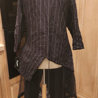 black and white abstract hemline top with mesh under layer and pocketless elastic waist pants