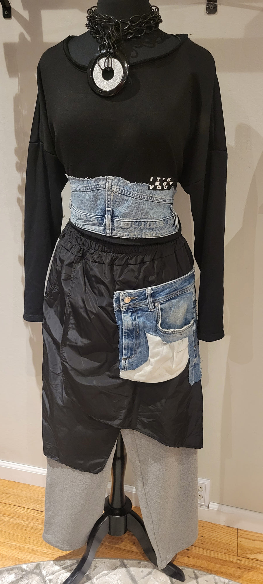 100% cotton sweatpants with a polyester wrap skirt overlay and exposed denim patch pocket